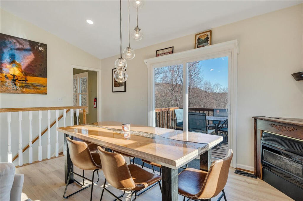 1039 Fosters Knob Road Blue Ridge, VA 24064 - Photo 7 of 45 a view of a dining room with furniture window and wooden floor