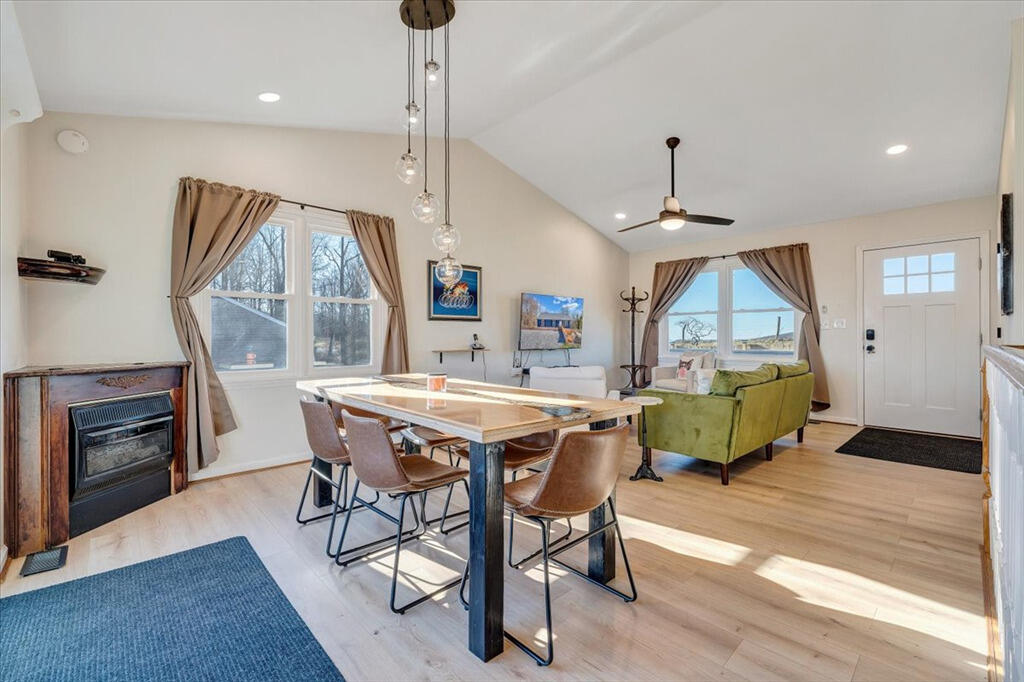 1039 Fosters Knob Road Blue Ridge, VA 24064 - Photo 8 of 45 a view of a dining room with furniture window and wooden floor