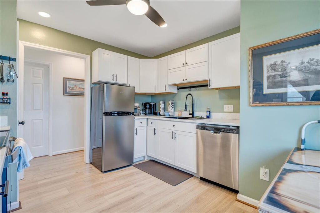 1039 Fosters Knob Road Blue Ridge, VA 24064 - Photo 9 of 45 a kitchen with stainless steel appliances granite countertop a refrigerator a sink a stove a microwave and island