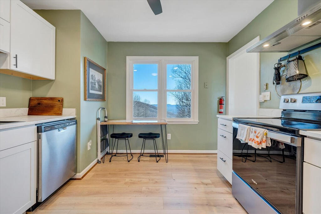 1039 Fosters Knob Road Blue Ridge, VA 24064 - Photo 10 of 45 a room with furniture and a wooden floor