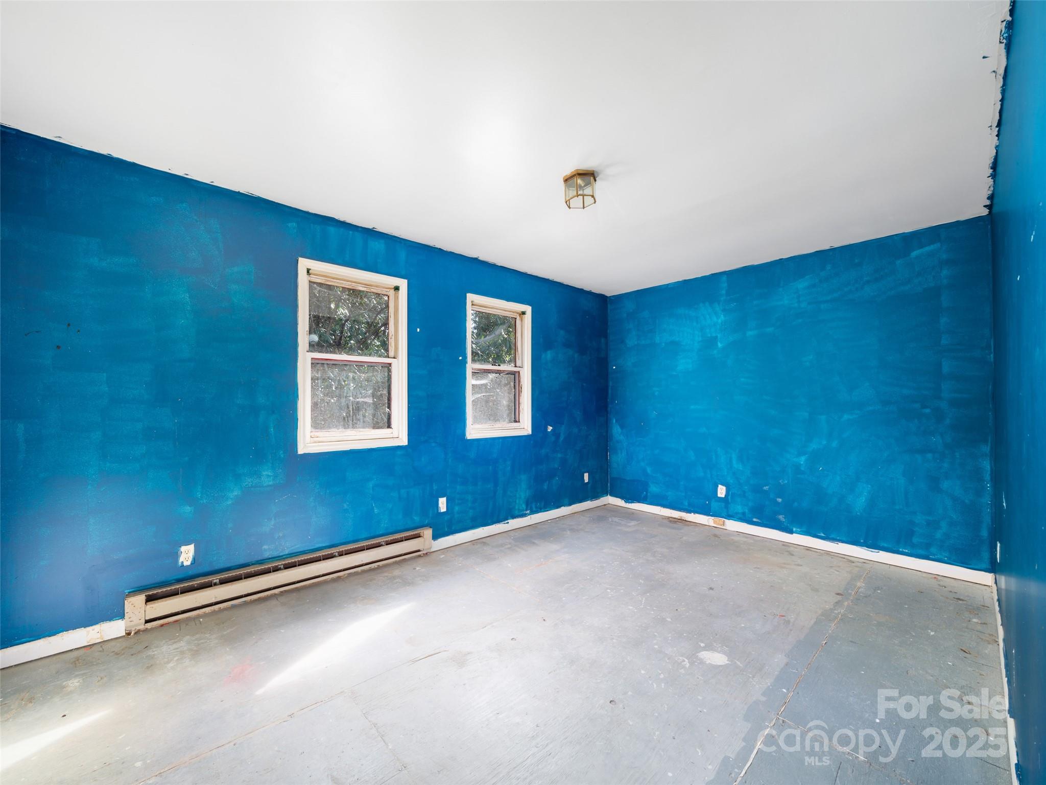 74 George Street Spruce Pine, NC 28777 - Photo 16 of 29 an empty room with windows