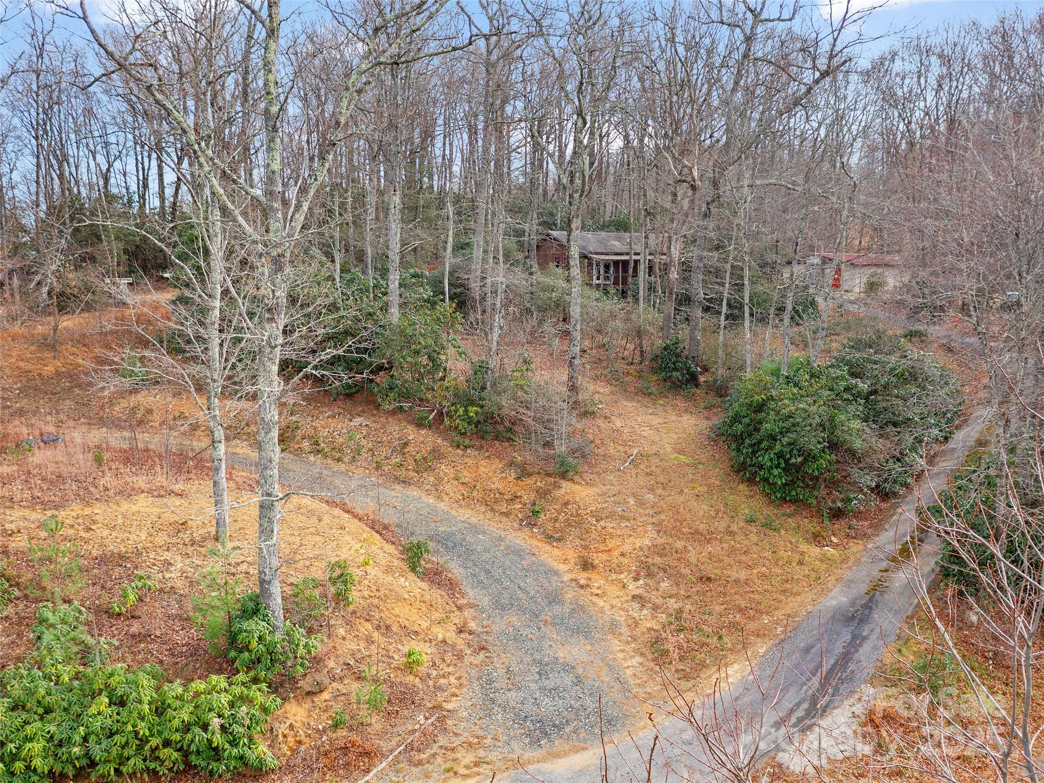 74 George Street Spruce Pine, NC 28777 - Photo 27 of 29 a backyard of a house with lots of green space