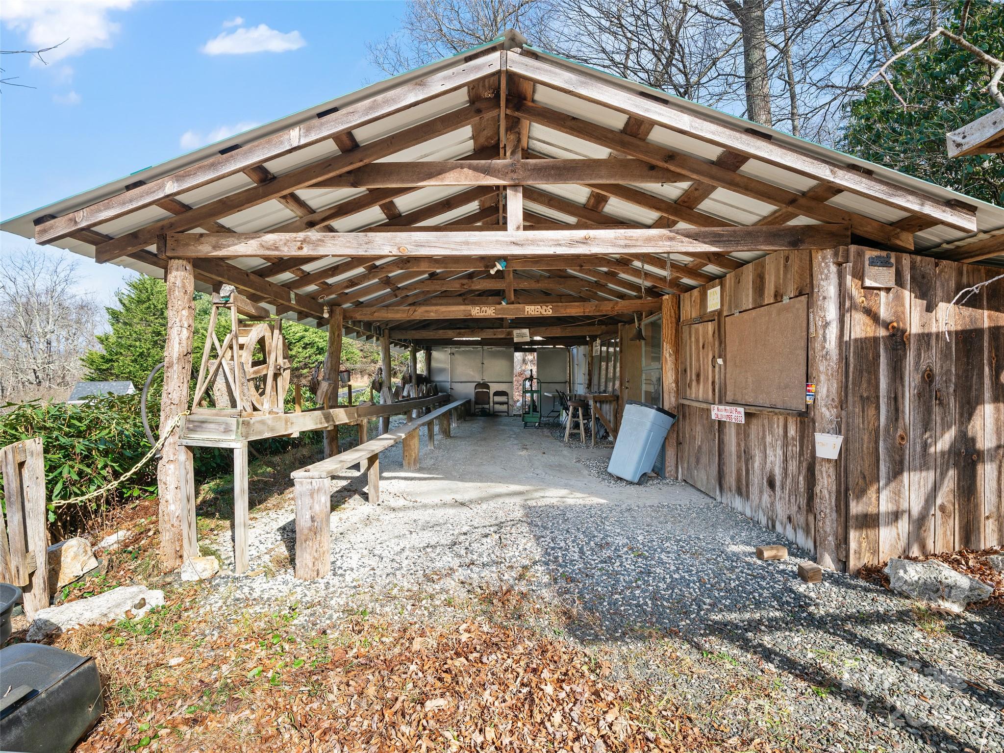 74 George Street Spruce Pine, NC 28777 - Photo 5 of 29 a view of a chairs with table in the patio