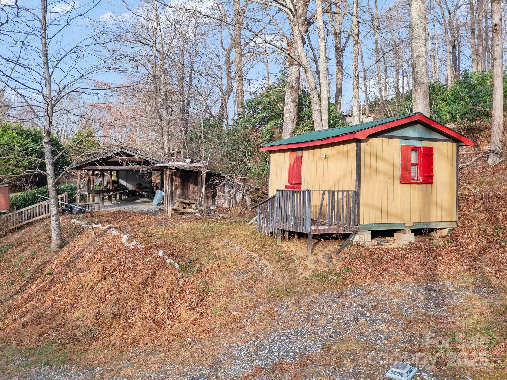 74 George Street Spruce Pine, NC 28777 - Photo 7 of 29 a view of backyard with deck and seating space