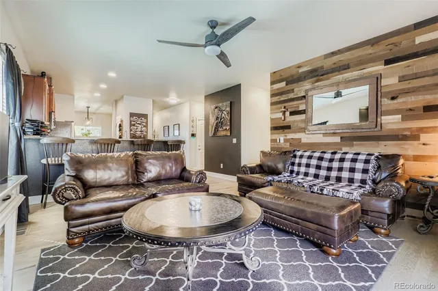 a living room with furniture and a rug