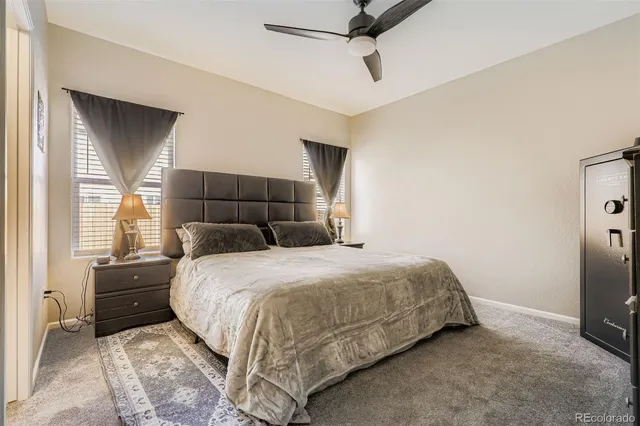 a bedroom with a bed and a tv