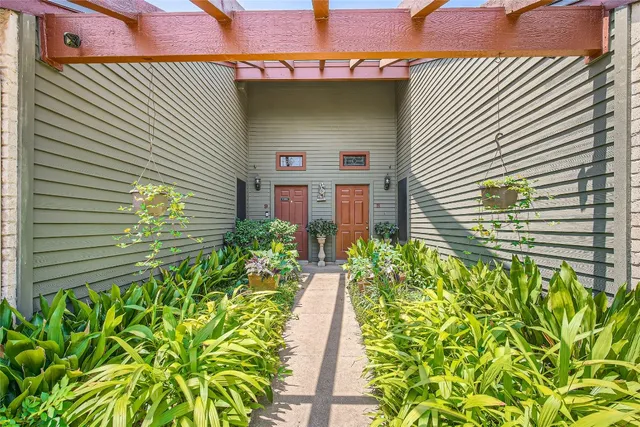 a potted plant sitting in front of a house
