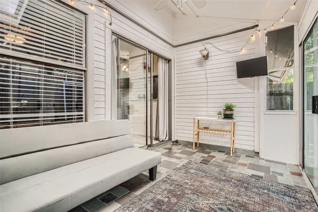 a backyard of a house with outdoor seating