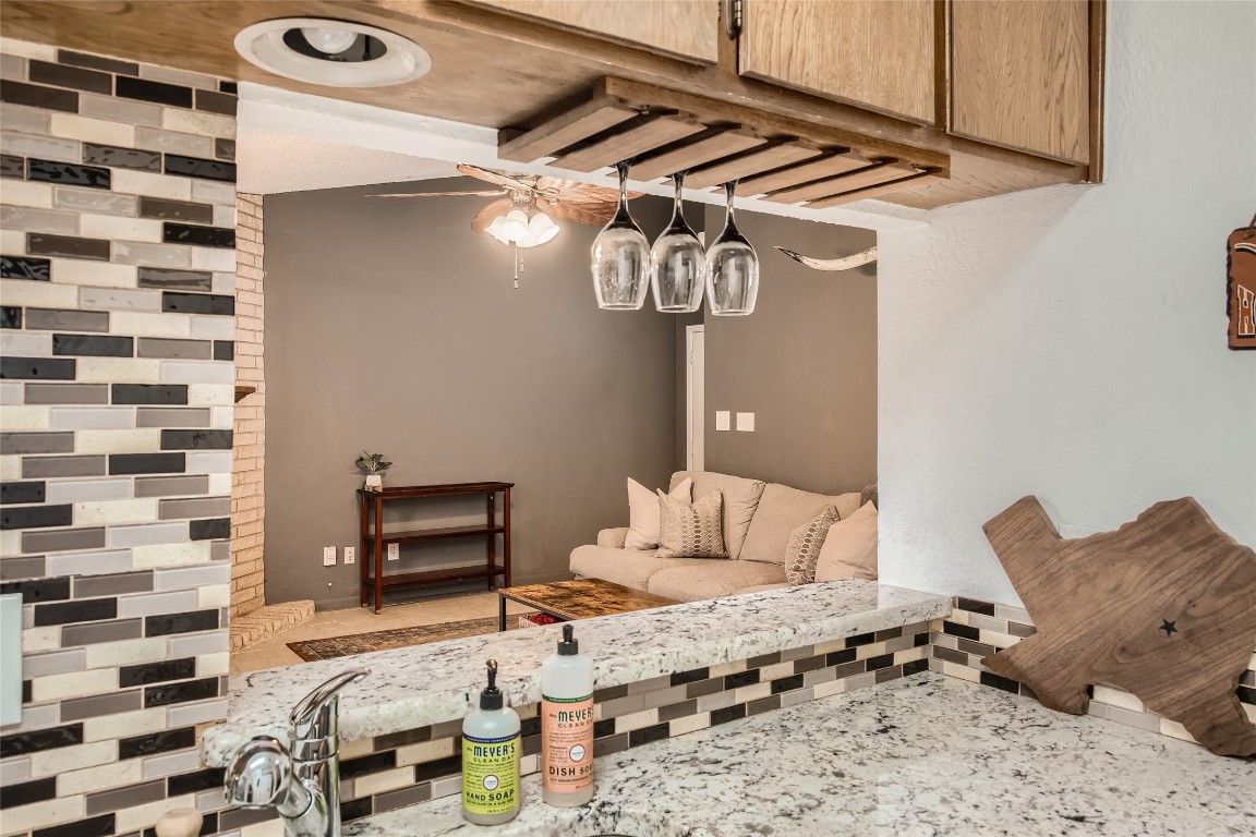 3815 Menchaca Road, Unit 9A Austin, TX 78704 - Photo 8 of 19 a bedroom with a bed and a chair