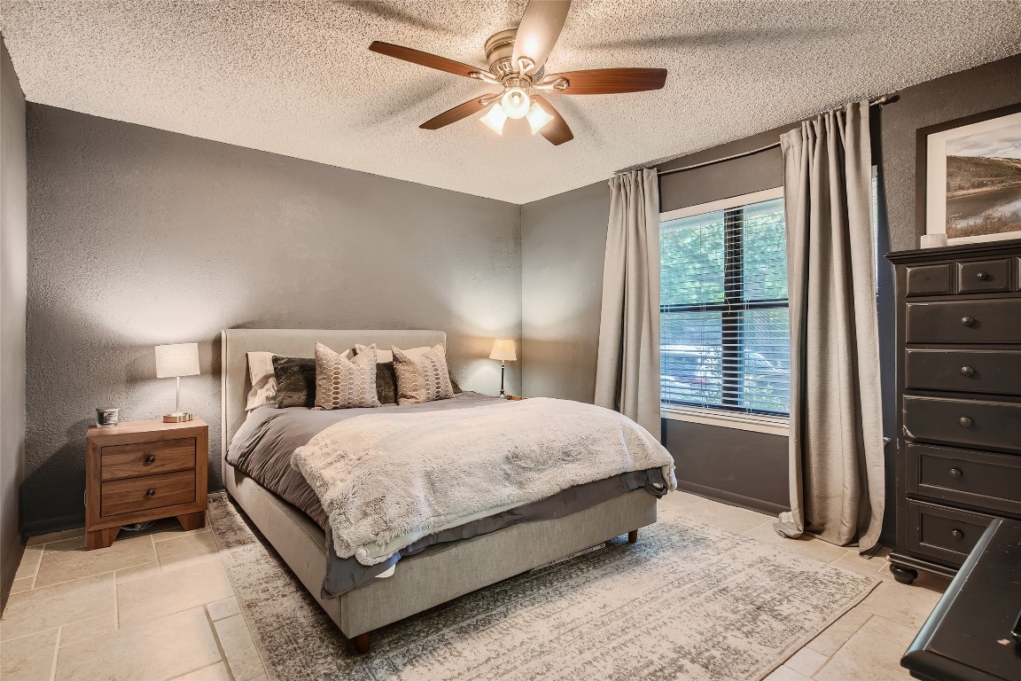 3815 Menchaca Road, Unit 9A Austin, TX 78704 - Photo 10 of 19 a bedroom with a bed and a window