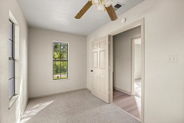 a view of an empty room and window