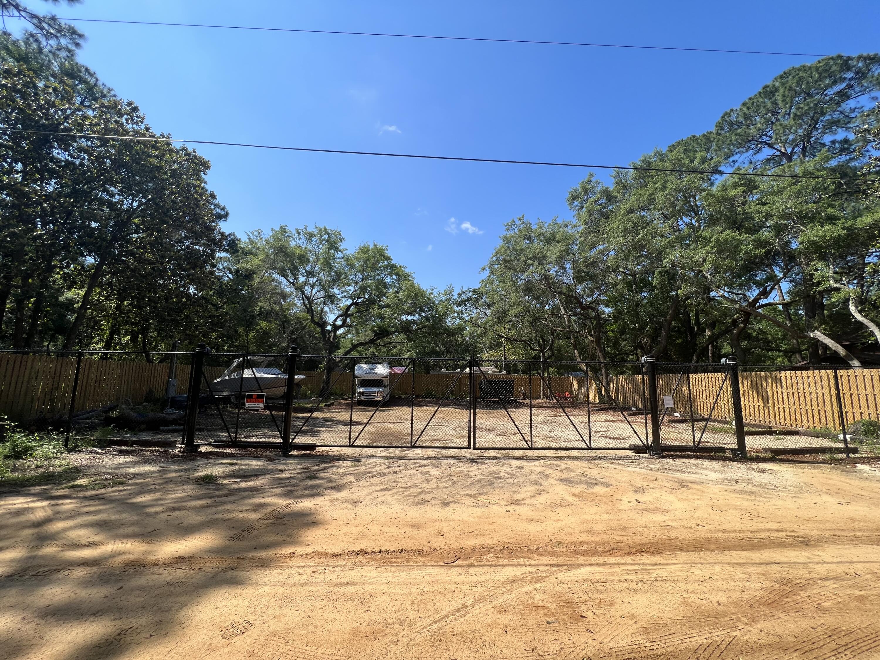 154 Madge Lane Santa Rosa Beach, FL 32459 - Photo 2 of 5 a view of house with snow on the road