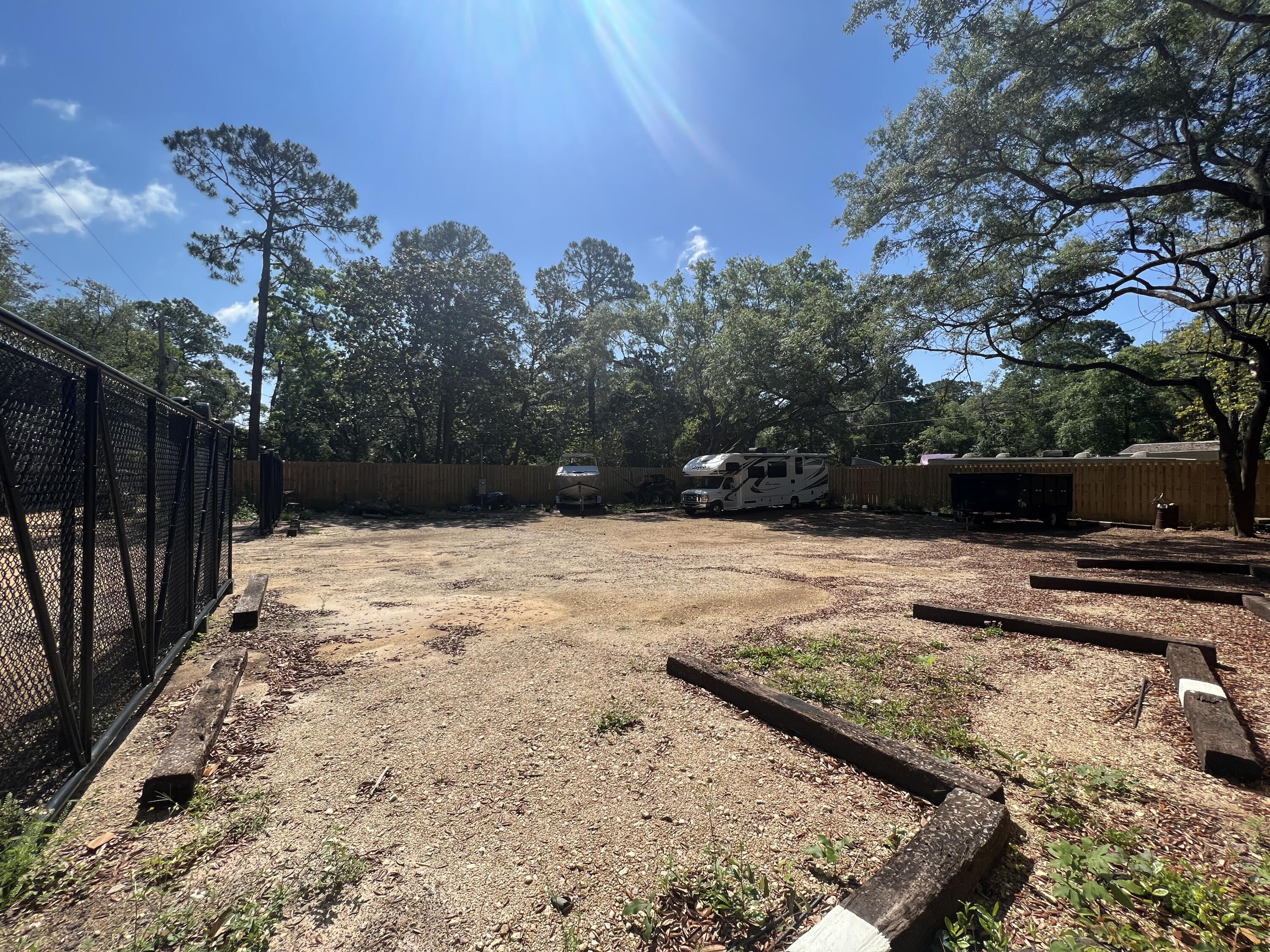 154 Madge Lane Santa Rosa Beach, FL 32459 - Photo 3 of 5 a view of a backyard of the house