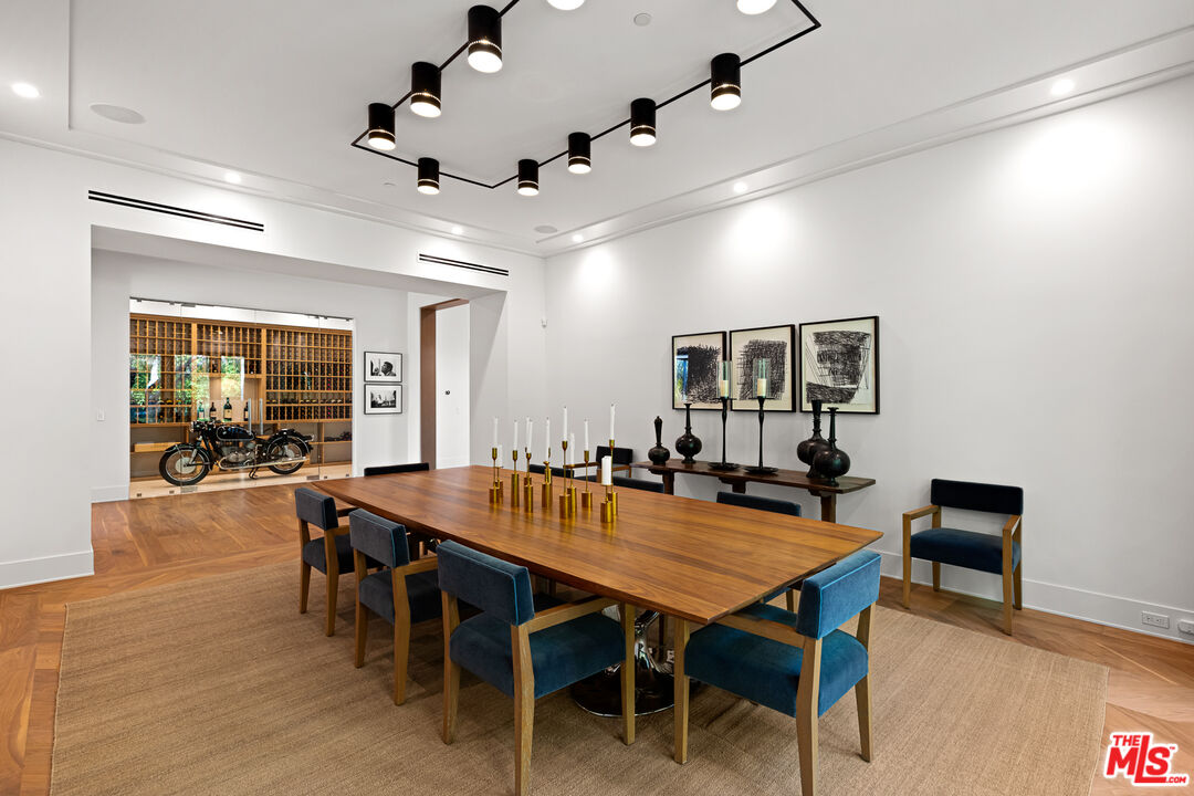 25210 Jim Bridger Road Hidden Hills, CA 91302 - Photo 15 of 65 a view of a dining room with furniture