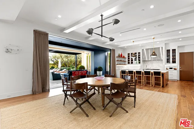 a kitchen with stainless steel appliances granite countertop a stove and a refrigerator