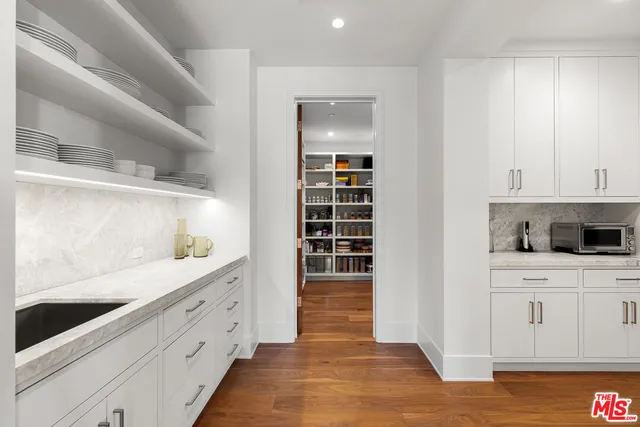 a large white tub sitting next to a window