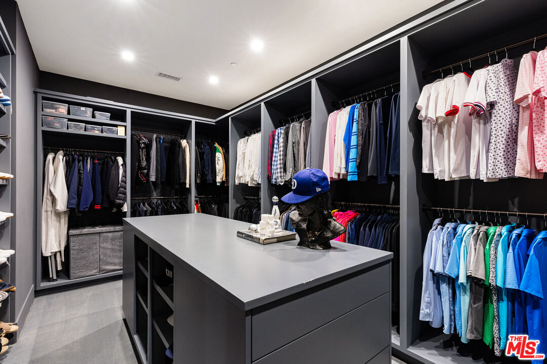 25210 Jim Bridger Road Hidden Hills, CA 91302 - Photo 41 of 65 a kitchen with a refrigerator and a sink