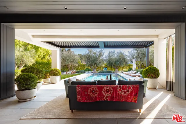 a outdoor living space with furniture and a fireplace