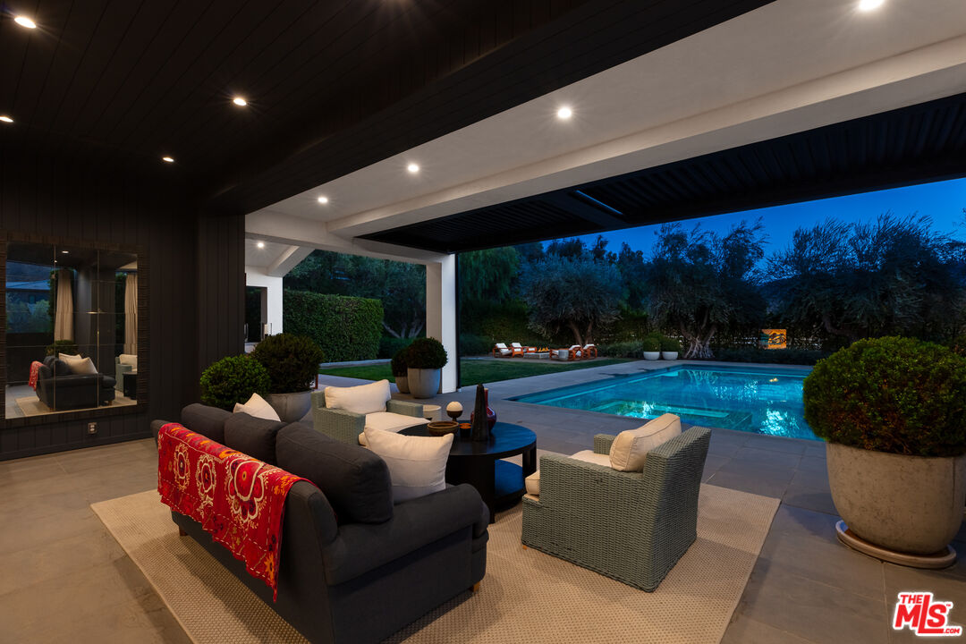 25210 Jim Bridger Road Hidden Hills, CA 91302 - Photo 59 of 65 a outdoor living space with patio furniture and garden