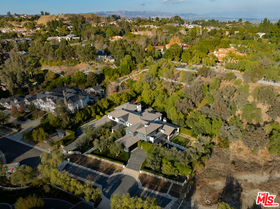 25210 Jim Bridger Road Hidden Hills, CA 91302 - Photo 64 of 65 an aerial view of residential houses with outdoor space