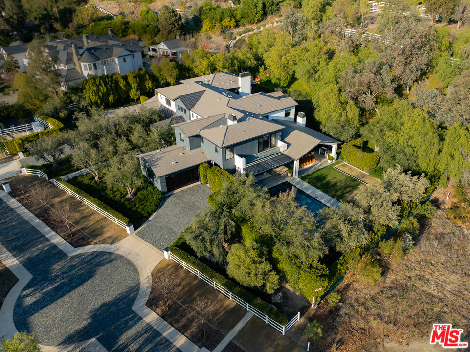 25210 Jim Bridger Road Hidden Hills, CA 91302 - Photo 65 of 65 an aerial view of a house with a yard basket ball court and outdoor seating