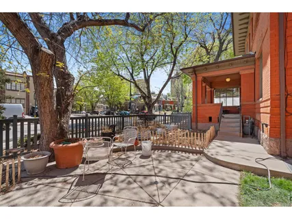 a view of a patio with a table and chairs