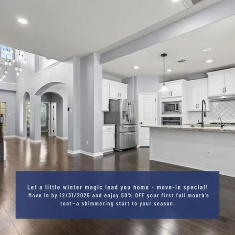 a view of kitchen with stainless steel appliances granite countertop sink stove and refrigerator