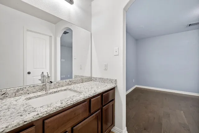 a house view with swimming pool in front of it