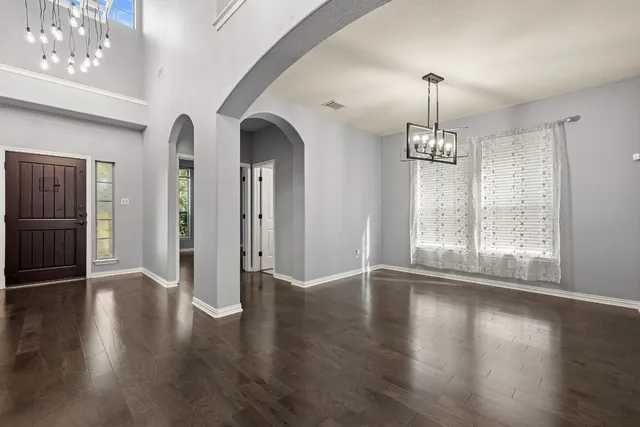 a view of a kitchen with a stove cabinets and wooden floor