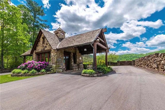 a view of a house with a garden and pathway