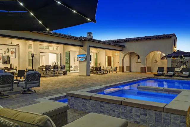 a living room with furniture pool table flat screen tv and a bathtub