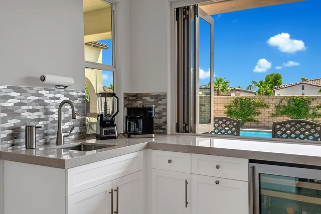 a view of a livingroom with furniture and a flat screen tv