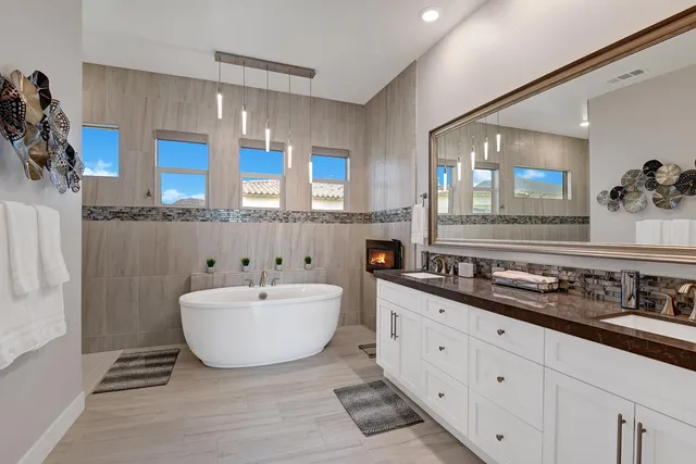 a living room with granite countertop furniture and a fireplace