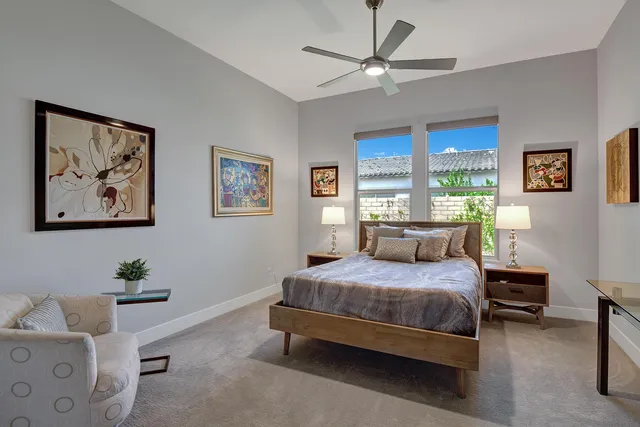 a bathroom with a granite countertop sink a toilet a mirror and shower