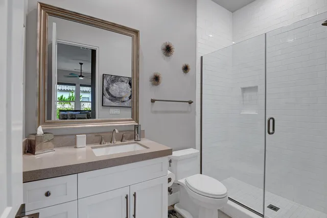 a bedroom with a bed a desk and chair