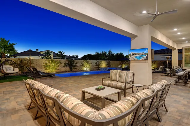 a view of a chairs and table in patio