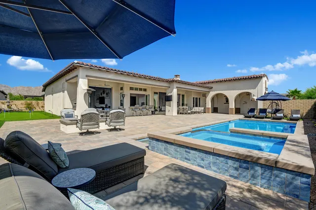 a kitchen with a table chairs stove and cabinets