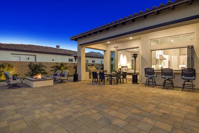a view of a chairs and tables in a patio