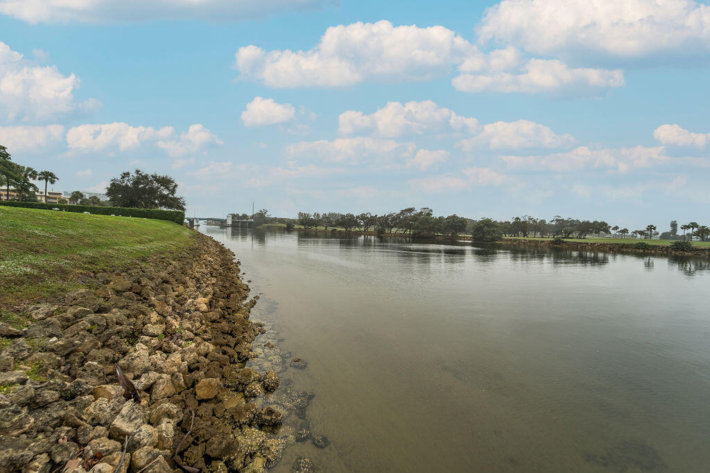 356 Golfview Road, Unit 505 North Palm Beach, FL 33408 - Photo 25 of 30 a view of a lake with houses in back