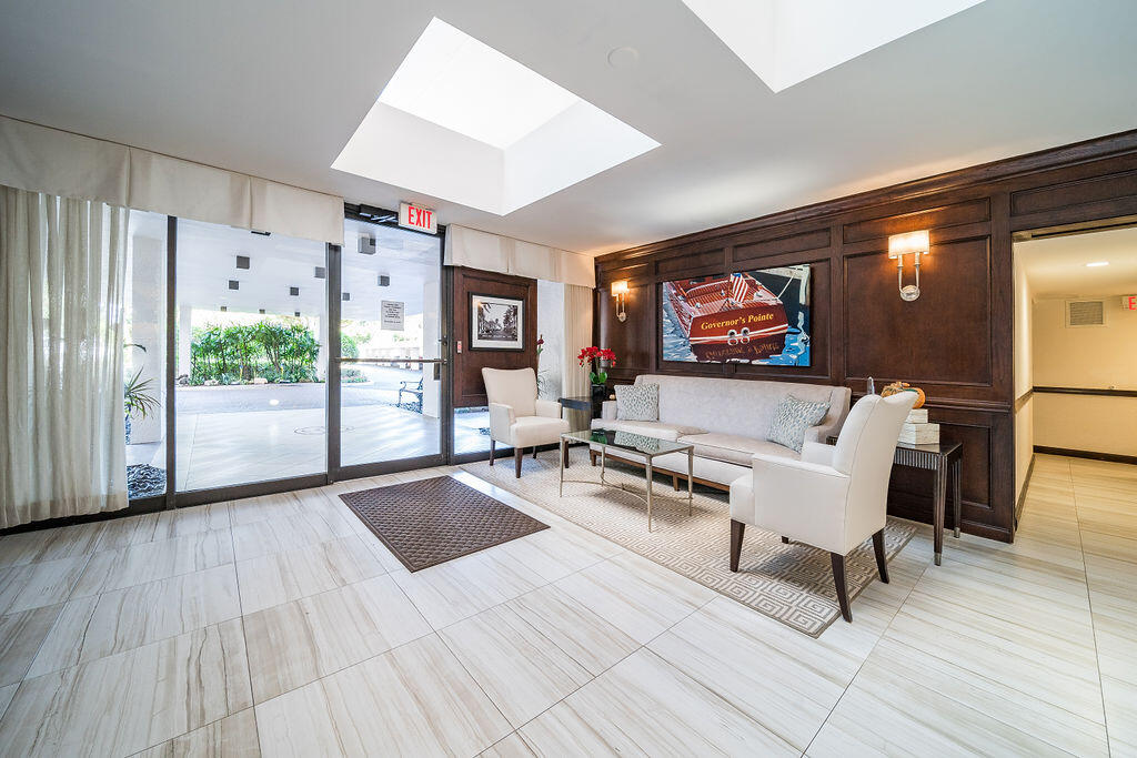 356 Golfview Road, Unit 505 North Palm Beach, FL 33408 - Photo 28 of 30 a living room with furniture and wooden floor