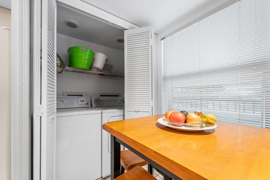 356 Golfview Road, Unit 505 North Palm Beach, FL 33408 - Photo 7 of 30 a kitchen with a sink a stove and a microwave
