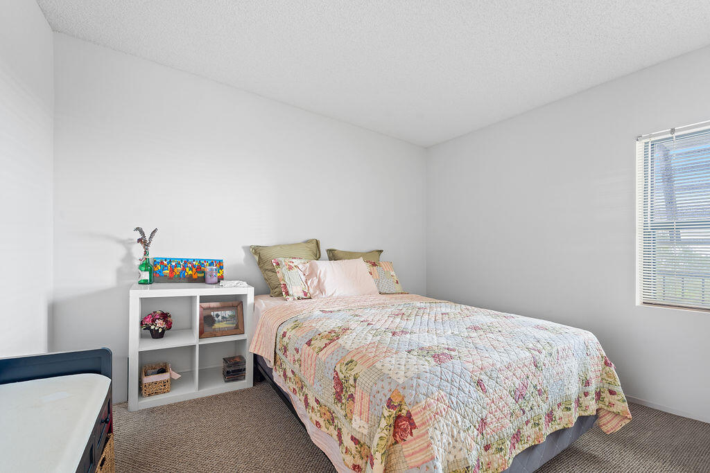 356 Golfview Road, Unit 505 North Palm Beach, FL 33408 - Photo 9 of 30 a bedroom with a bed and a window