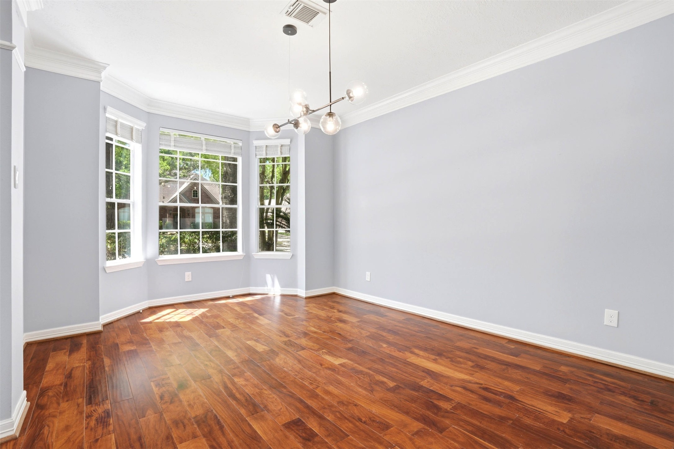 4707 Stackstone Lane Katy, TX 77450 - Photo 11 of 50 a view of an empty room with wooden floor and a window