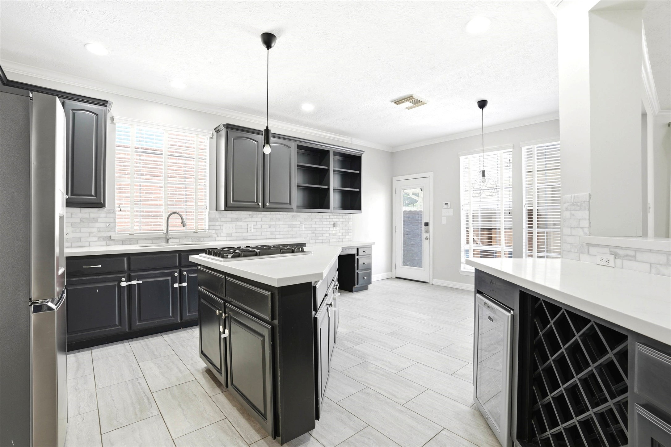 4707 Stackstone Lane Katy, TX 77450 - Photo 12 of 50 a kitchen with a stove sink and cabinets