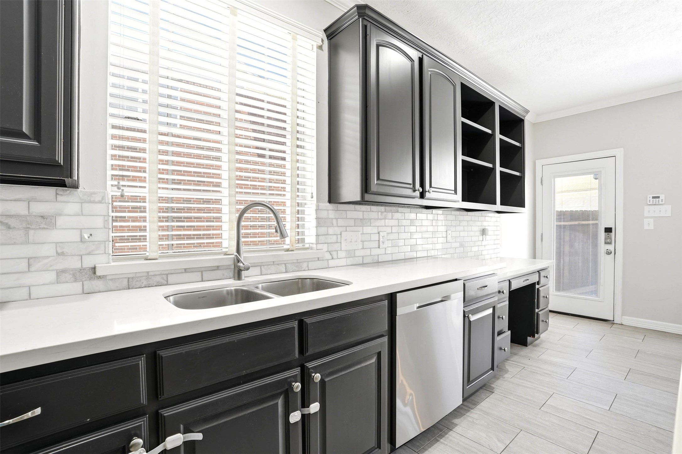 4707 Stackstone Lane Katy, TX 77450 - Photo 17 of 50 a kitchen with a sink and cabinets