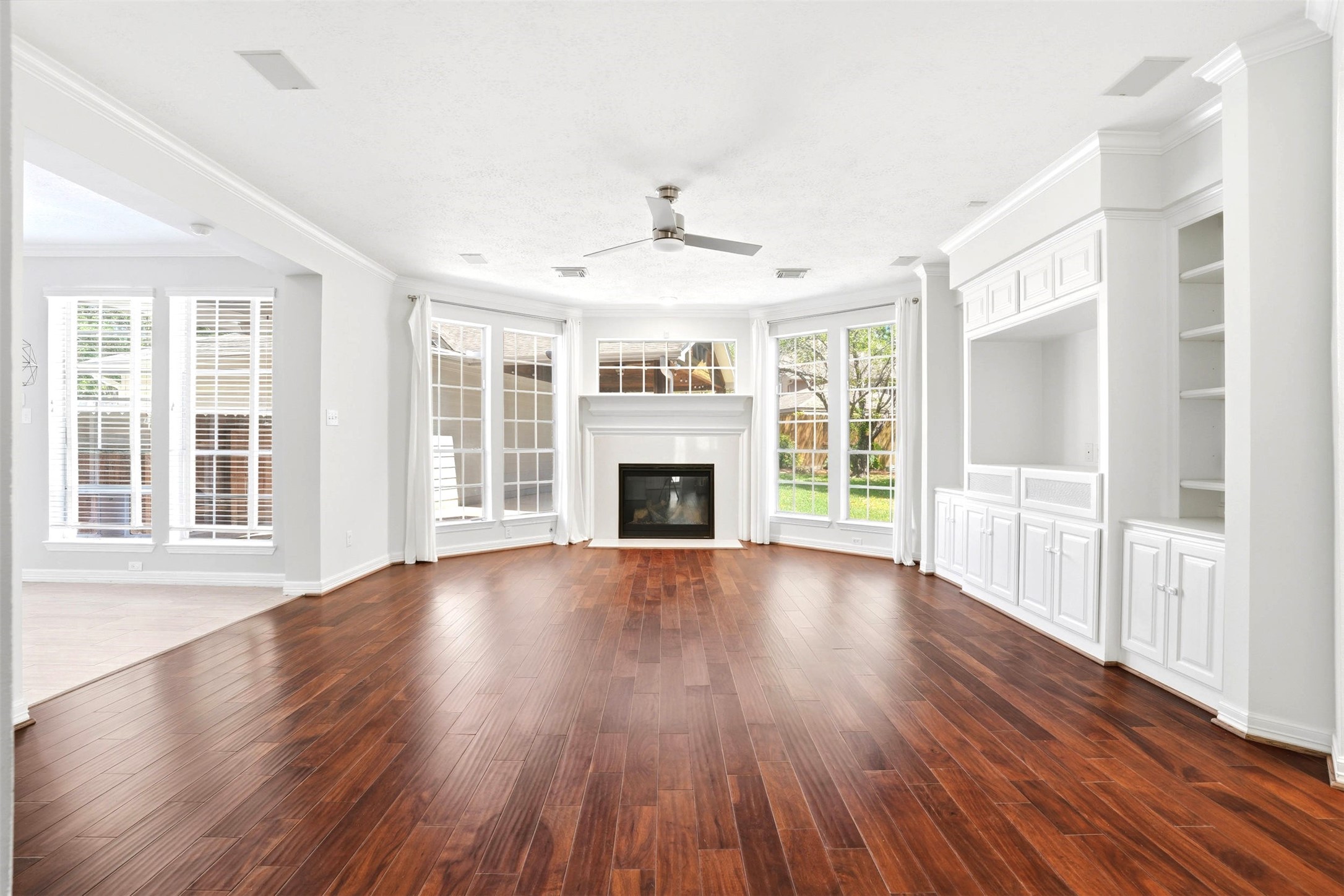 4707 Stackstone Lane Katy, TX 77450 - Photo 19 of 50 a view of an empty room with wooden floor and a window