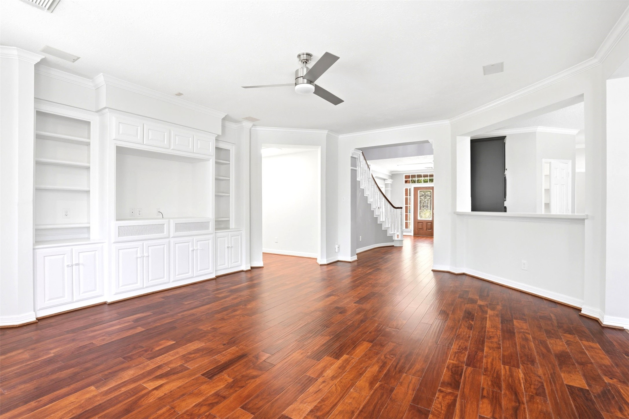 4707 Stackstone Lane Katy, TX 77450 - Photo 20 of 50 a view of an empty room with wooden floor and a window