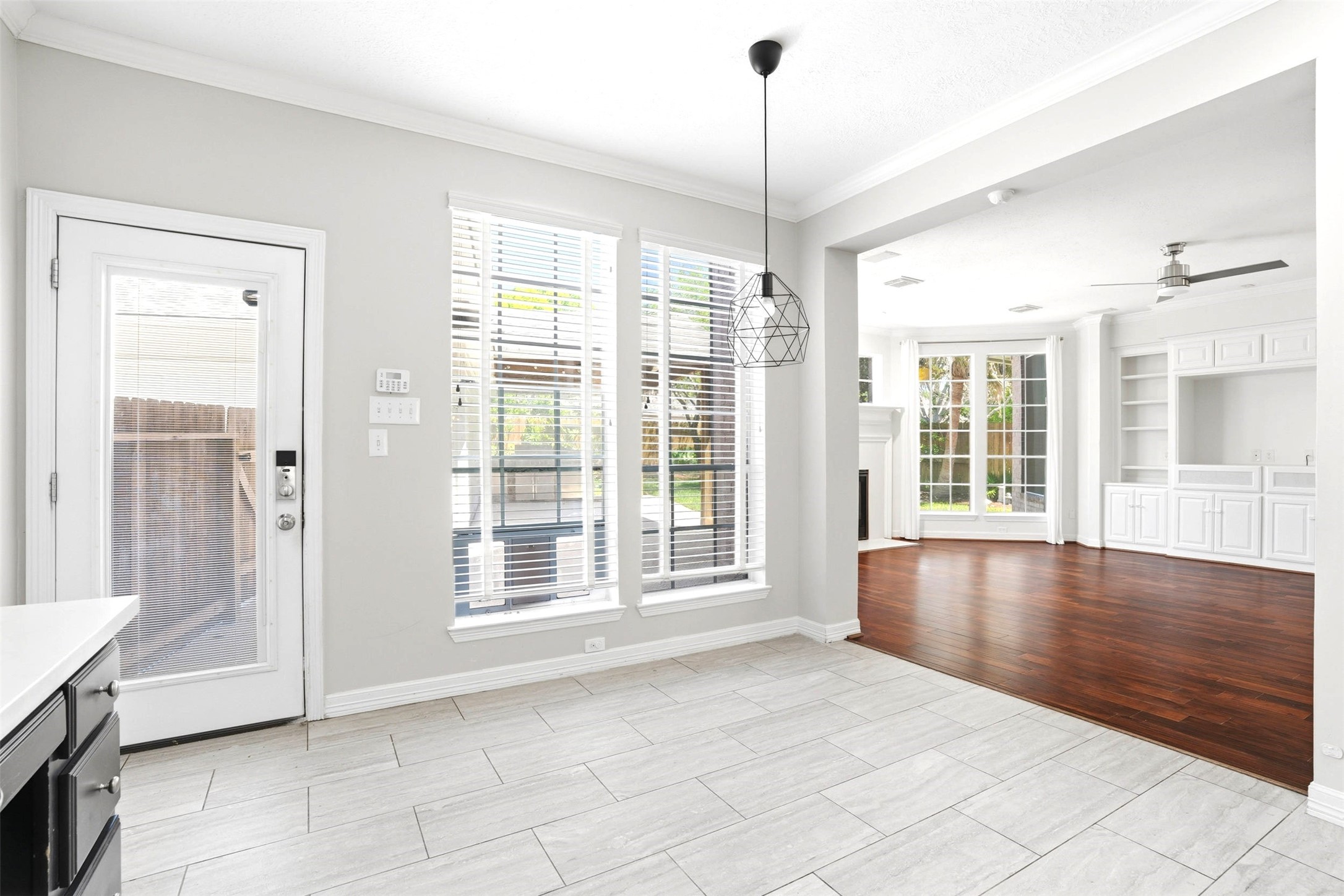 4707 Stackstone Lane Katy, TX 77450 - Photo 21 of 50 a view of an empty room with a window and wooden floor