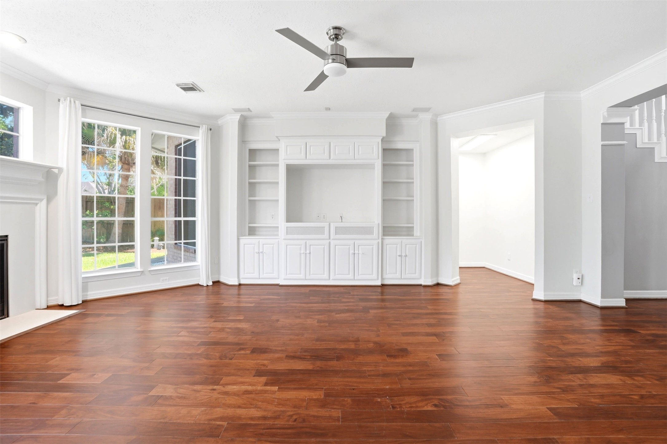 4707 Stackstone Lane Katy, TX 77450 - Photo 22 of 50 a view of an empty room with a window and wooden floor