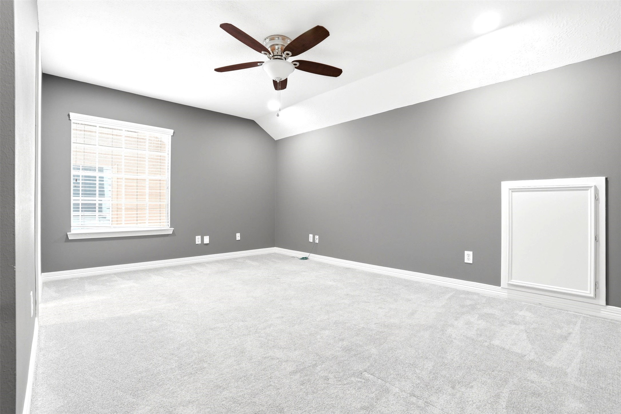 4707 Stackstone Lane Katy, TX 77450 - Photo 27 of 50 an empty room with a window and a ceiling fan